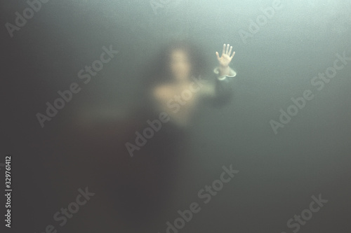siren woman swimming underwater behind glass surface, surreal concept 