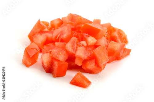 Heap of finely diced tomato on white background