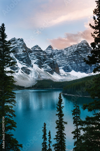 Iconic Moraine Lake sunset view with snowy mountains in the Valley of Ten Peaks, Banff National Park, Alberta, Canada