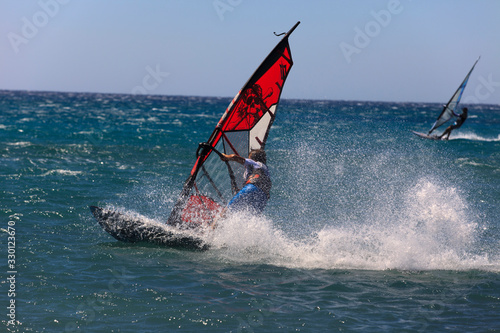 Prasonissi, Rhodes / Greece - June 23, 2014: Surfer at Cape of Akra Prasonisi, Rhodes, Dodecanese Islands, Greece.
