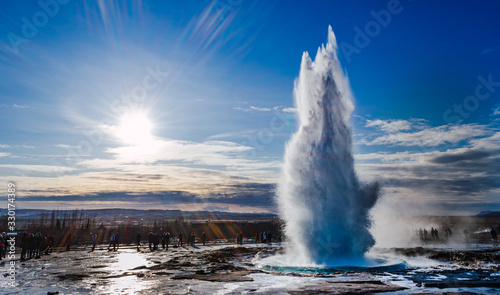 Geyser in sunny winter day in Iceland.