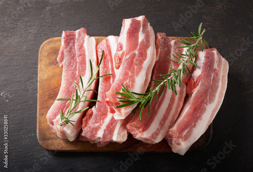 fresh pork ribs with rosemary, top view