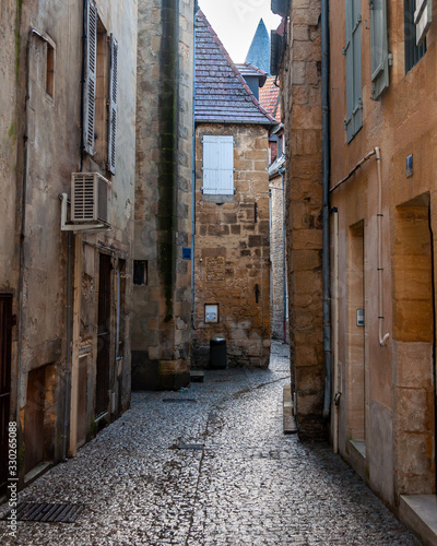 Sarlat in Aquitaine, France. The capital of Périgord Noir, a medieval village full of picturesque alleys and monuments. View of a typical alley in the historic center.