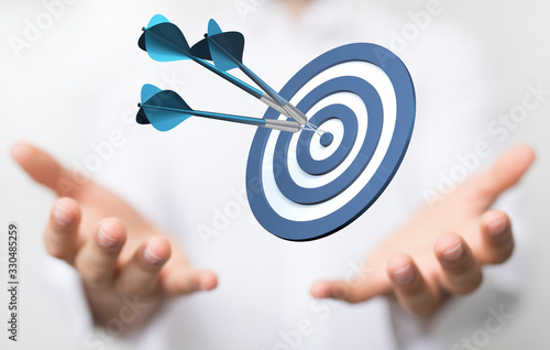 arrow hitting in the target center of dartboard on bullseye.