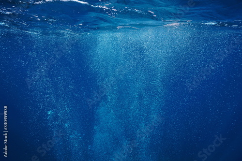 Air bubbles underwater rising to water surface, natural scene, Mediterranean sea, France