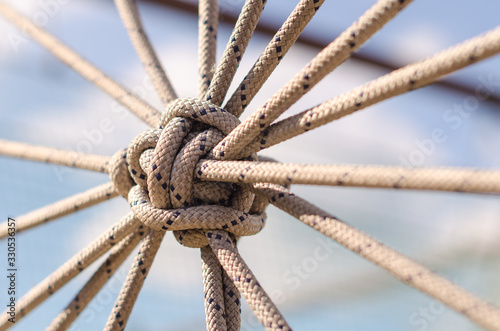 many ropes and one big knot close up
