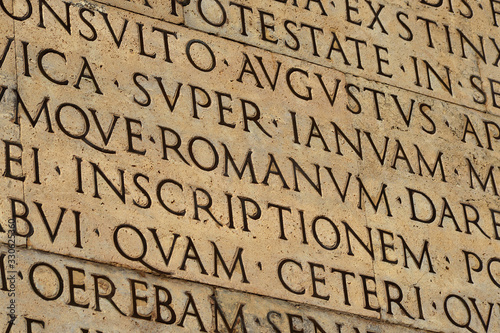 Latin ancient language and classical education. Inscription from Emperor Augustus famous Res Gestae (1st century AD), with the word Romanum in the center