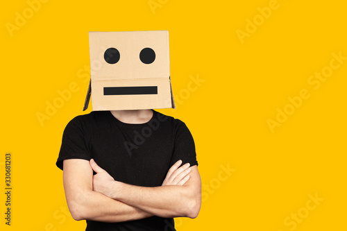 Portrait of an indifferent man with a box and cartoony emotions on his head. Unhappy people.