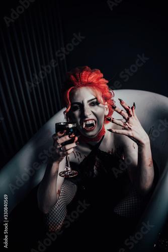 Vampire in underwear in a blood bath