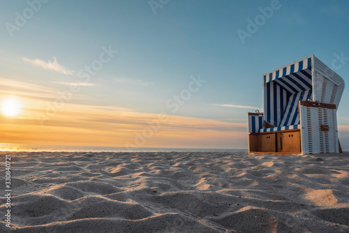 White sand beach and wicker chair on Sylt island