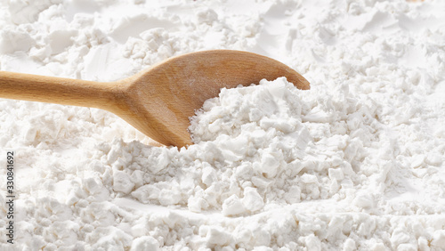 Background of corn starch flour powder texture close-up.