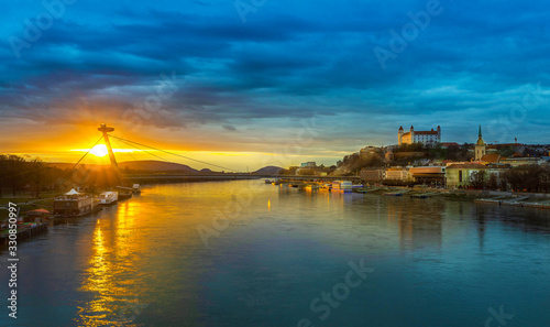 Bratislava castle and restaurant during sunset under cloudy weather.