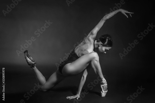 black and white vintage dramatic portrait of a dancing girl-ballerina