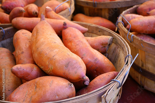 Basket of orange sweet potatoes at a farmers market