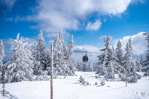 Cable car. Beautiful winter landscape with snow covered trees and cable car travel. Krkonose, Pec pod Snezkou.