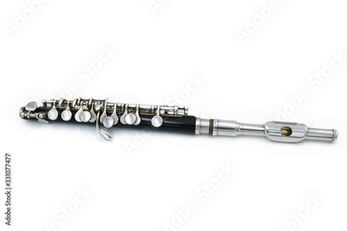 Black piccola flute on a white isolated background