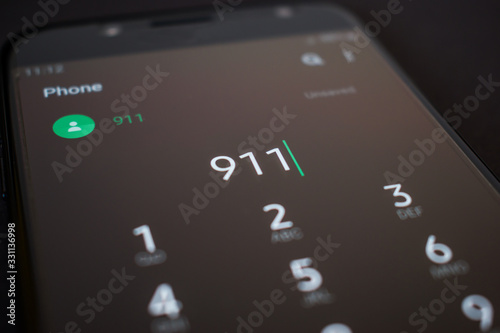 Emergency 911 call on smartphone, mobile phone, close up