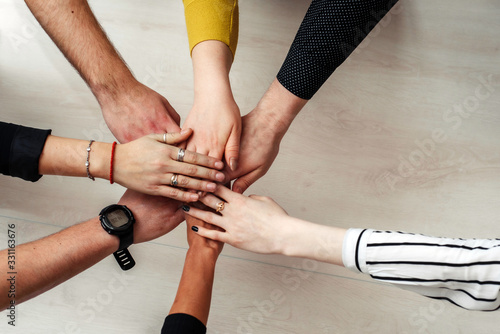 Group of Diverse Multiethnic People Teamwork Concept. Teamwork Togetherness Collaboration Concept. Hands of office workers in a circle