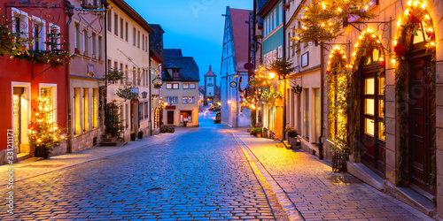 Panoramic view of Christmas street with gate and tower Plonlein in medieval Old Town of Rothenburg ob der Tauber, Bavaria, southern Germany
