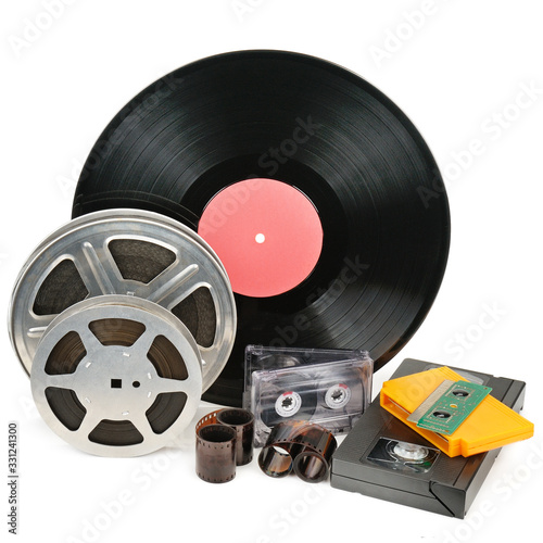 Vinyl record, video and audio cassettes isolated on white background.