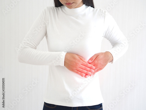 hepatosplenomegaly or hsm and ruptured spleen in woman ,She touching on chest and symptoms of pain and suffering in the upper right portion of abdomen and above stomach and use for health care concept