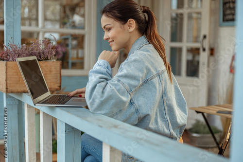 Beautiful dark-haired lady sitting at a computer