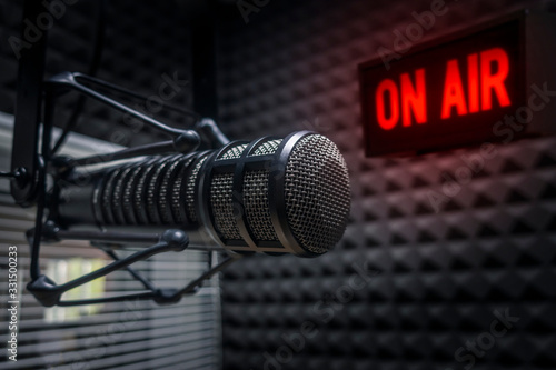 Professional microphone in radio station studio on air