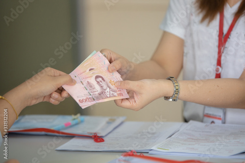 Pay cash concept. Thai baht cash on hand Thai baht exchange for business