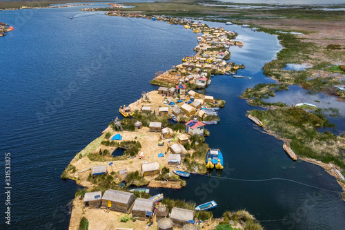 Aerial view of Uros Floating Islands on Lake Titicaca, the highest navigable lake in the world, on the border of Peru and Bolivia, South America.