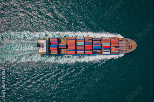 cargo ship sailing on the sea top view from drone