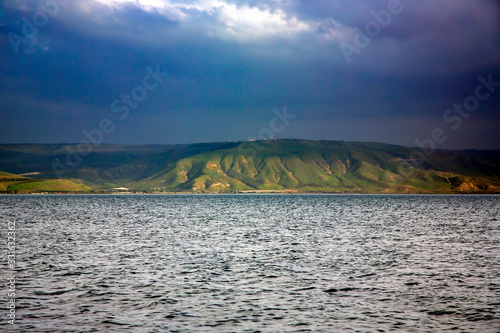 Kinneret Lake or Galilee sea in Tiberius overlooking the Golan Heights on a background of a stormy sky, Israel, Middle East.