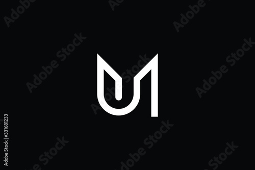 Minimal elegant monogram art logo. Outstanding professional trendy awesome artistic MU UM initial based Alphabet icon logo. Premium Business logo in White color on black background