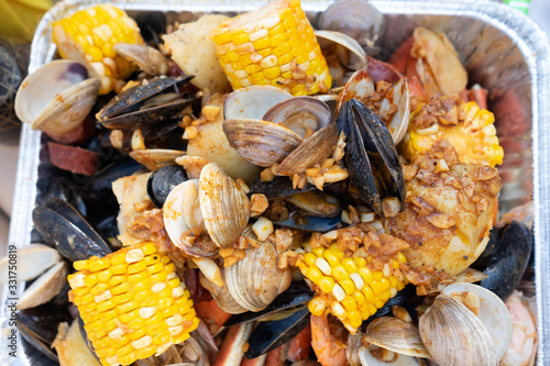 Clambake with clams, garlic, shirmp, crab