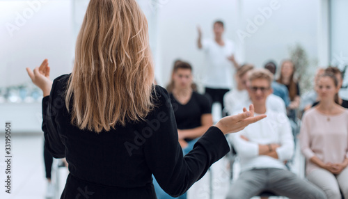 background image of a business seminar in a bright conference room