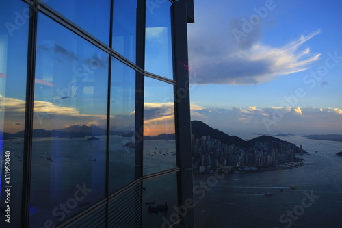 dusk of hong kong with the office window reflection