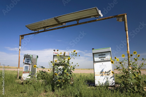 Weeds growing over old gas pumps on the old Lincoln Highway, US 30, Nebraska Byway, America's first transcontinental highway, Nebraska