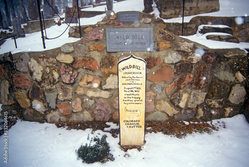 Grave site of Wild Bill Hickock, infamous outlaw in Mount Moriah Cemetery, Deadwood, SD in winter snow