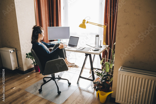 woman working at home. telework on laptop