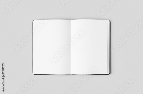 Notebook inside mockup on a grey background.