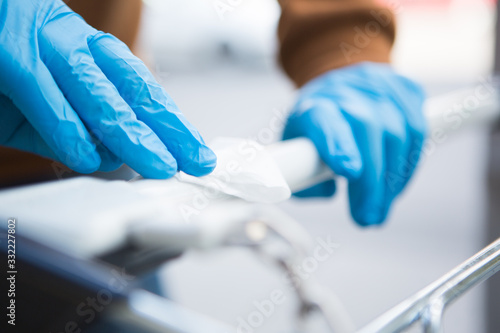 Disinfecting the handle of shopping basket. Coronavirus Epidemic Outbreak