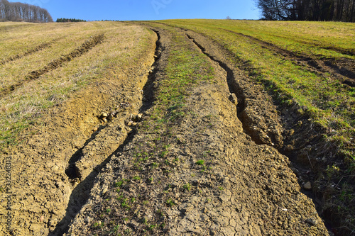 Water erosion of grass field erosive soil damage