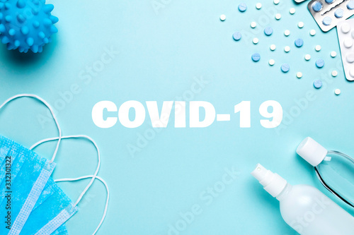 Surgical face masks, hand sanitizer gel, spay and pills. Coronavirus, Covid-19 preventions concept.
