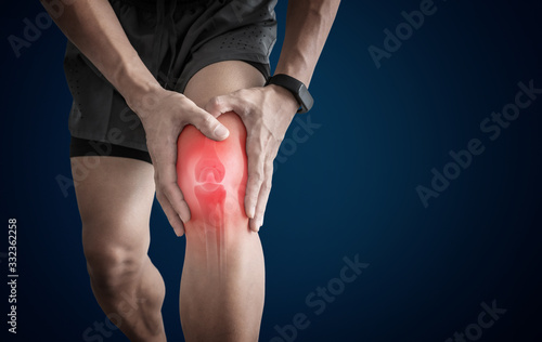 Joint pain, Arthritis and tendon problems. a man touching nee at pain point