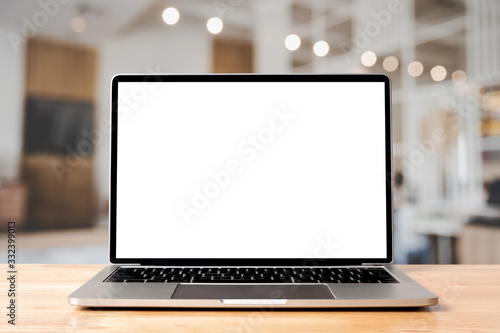 Laptop blank screen on wood table with coffee cafe background, mockup, template for your text, Clipping paths included for background and device screen