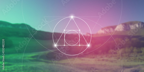 Philosopher stone sacred geometry spiritual new age futuristic illustration with transmutation interlocking circles, triangles and glowing particles in front of blurred background.