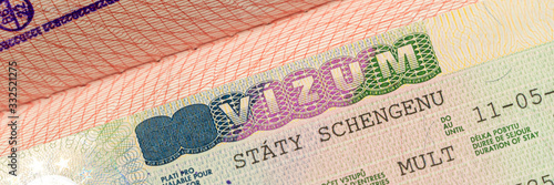 Close up Schengen visa in the passport. closed border of EC. Wide banner