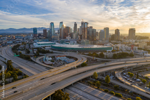 Aerial view of empty freeway streets with no people in downtown Los Angeles California USA due to coronavirus pandemic or COVID-19 virus outbreak and quarantine