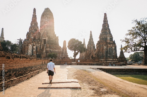 Traveler tourist man walking at Chaiwatthanaram temple of Ayutthaya in the Thailand. ayutthaya historical park, Ayutthaya, Thailand.