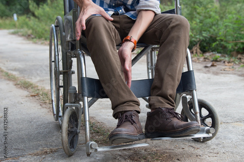 Disabled man is wheelchair at street.concept