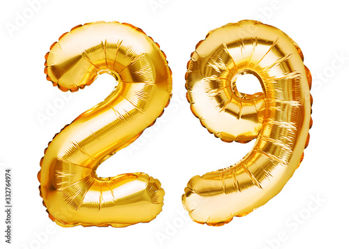 Number 29 twenty nine made of golden inflatable balloons isolated on white. Helium balloons, gold foil numbers. Party decoration, anniversary sign for holidays, celebration, birthday, carnival